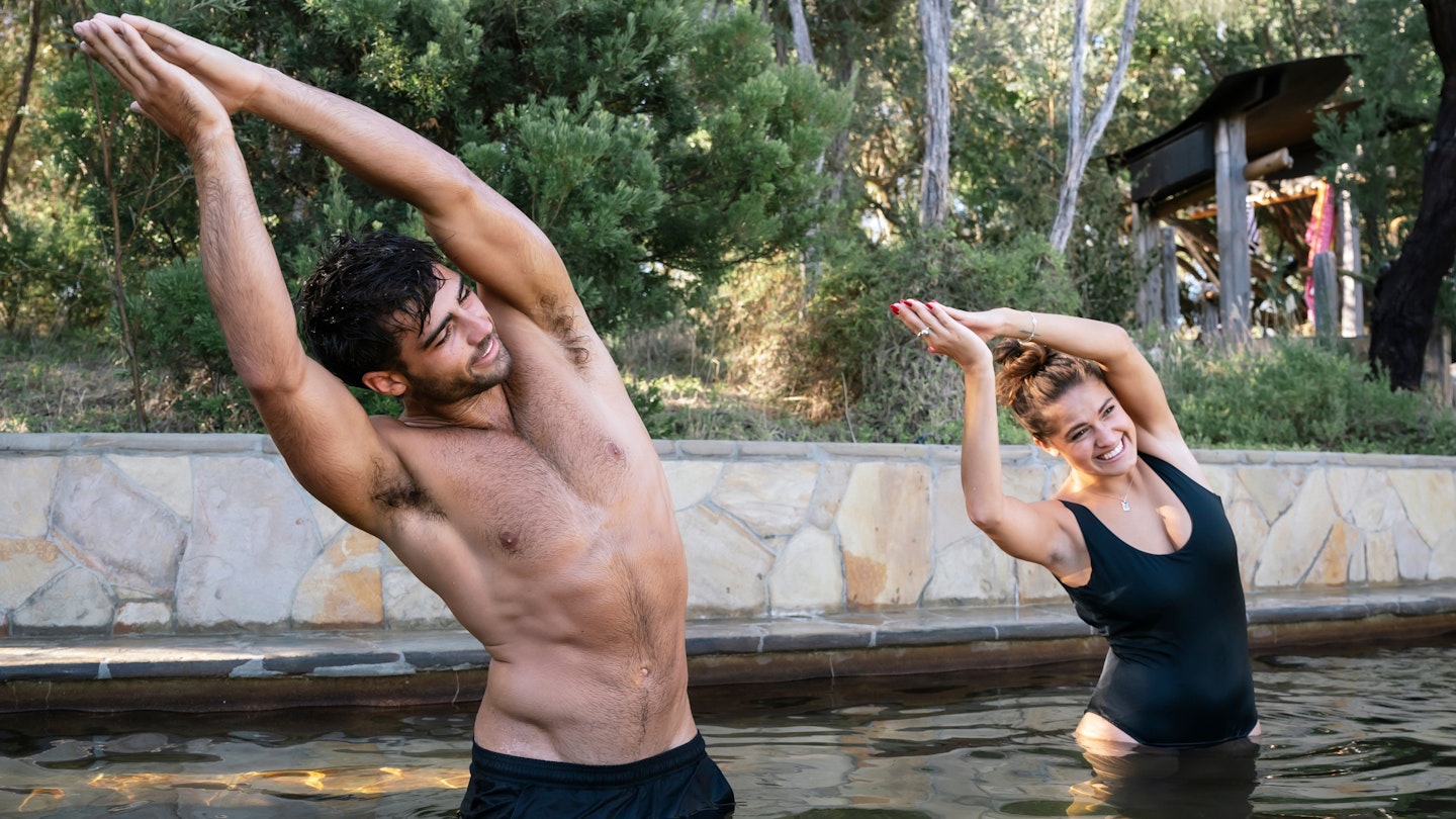 two people doing hot springs yoga