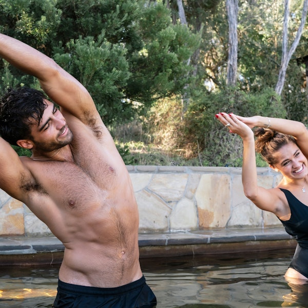 two people doing hot springs yoga
