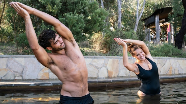 two people doing hot springs yoga