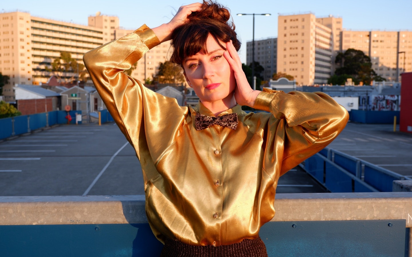 a girl in a gold blouse