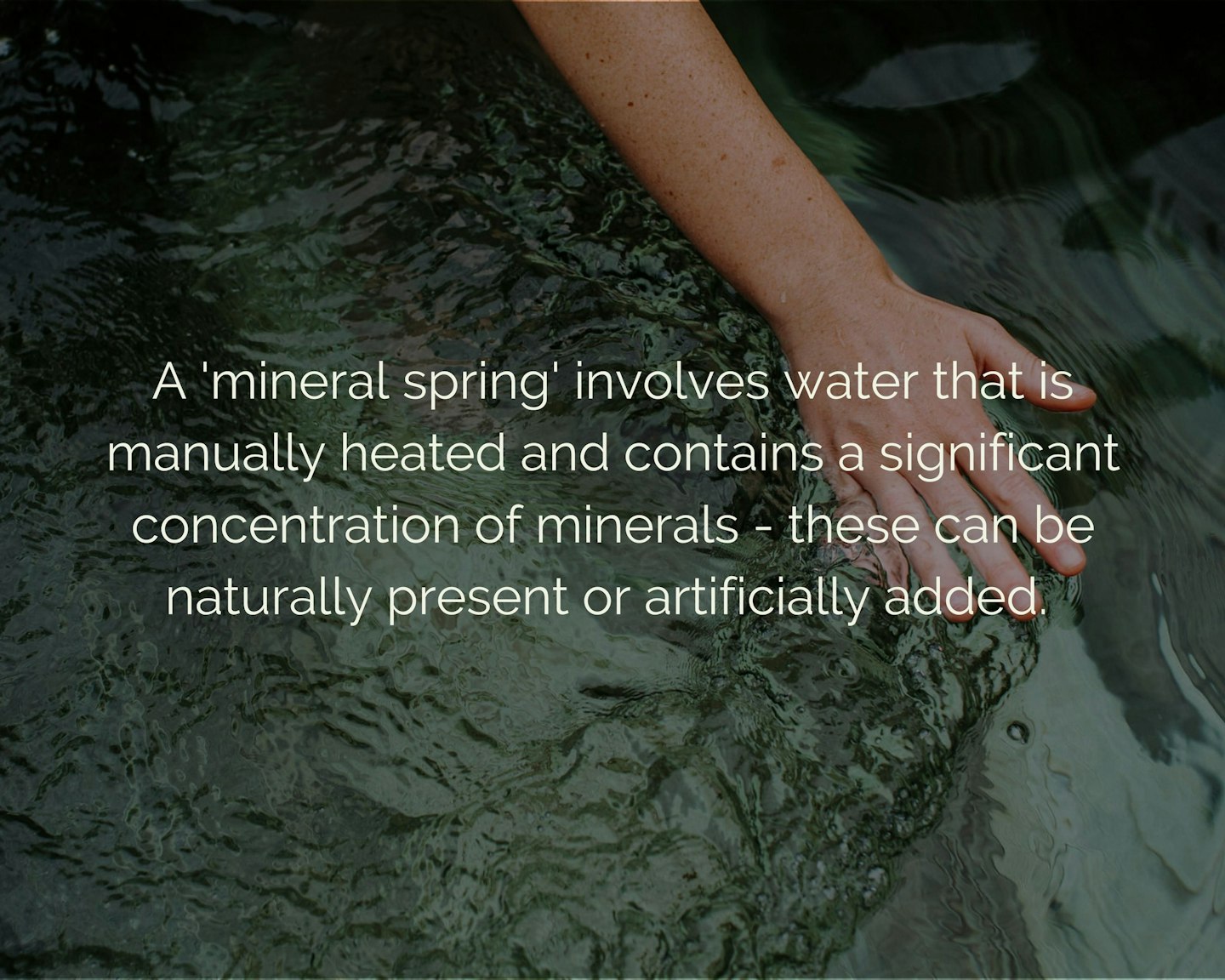 Text "A 'mineral spring' involves water that is manually heated and contains a significant concentration of minerals - these can be naturally present or artificially added" overlaying an image of water with a hand running through.