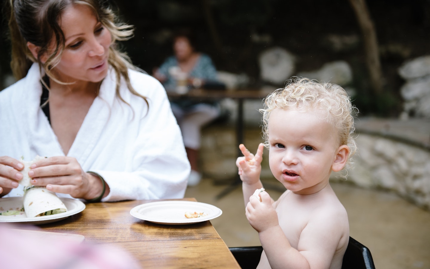 woman and baby enjoying something to eat together
