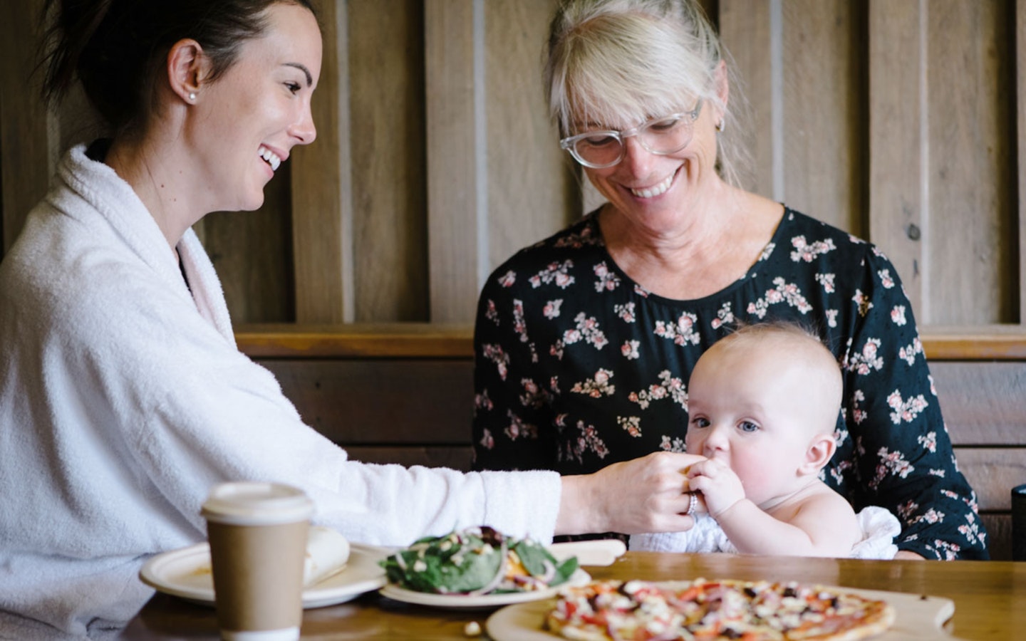 woman, mother and baby enjoying something to eat