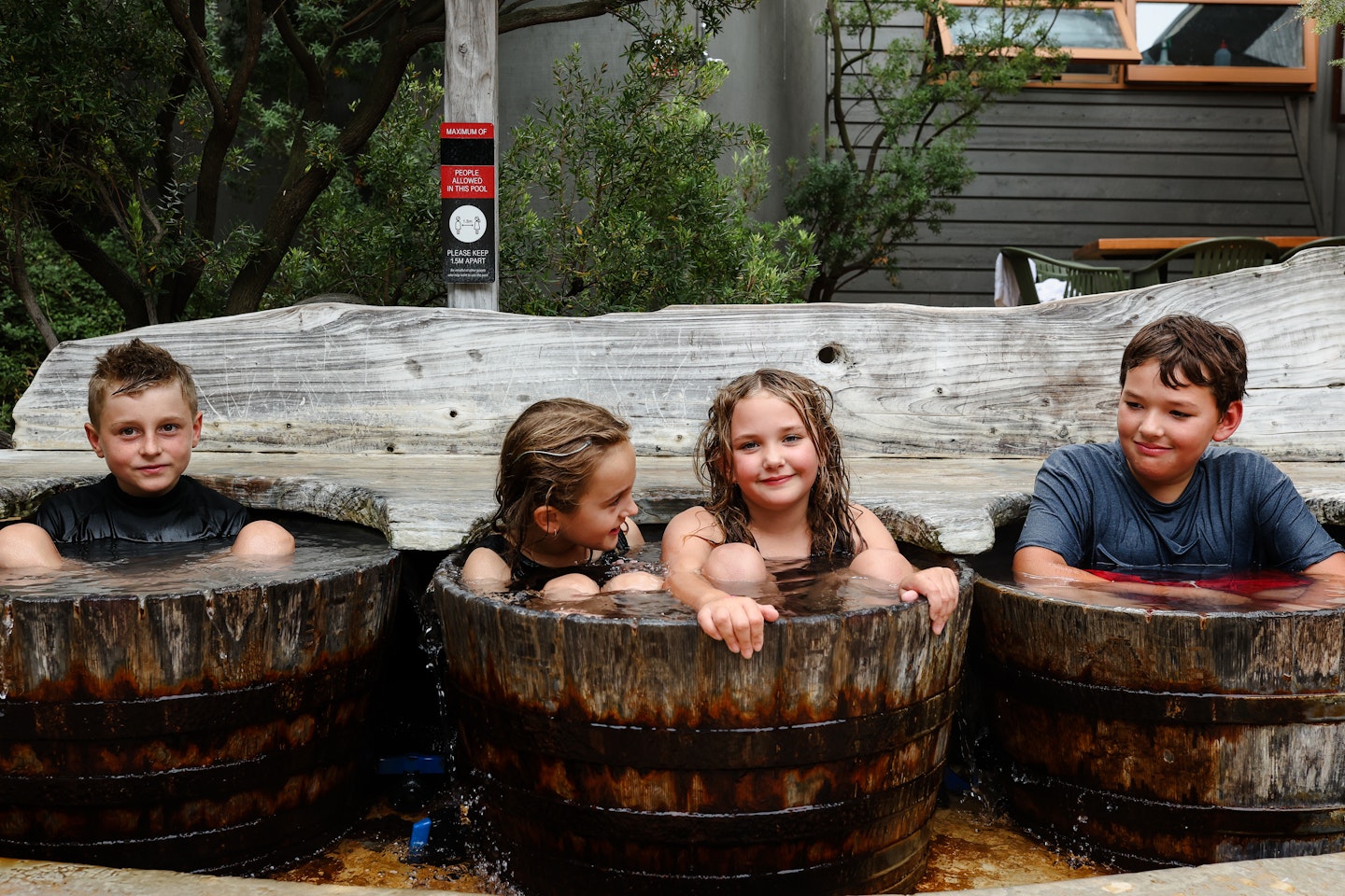 Kids in bathing barrels