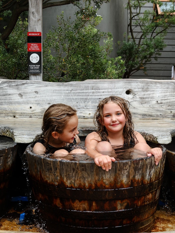 Kids in bathing barrels