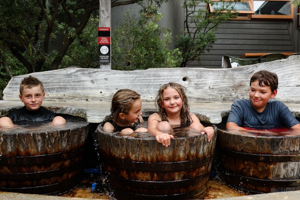 Kids in bathing barrels