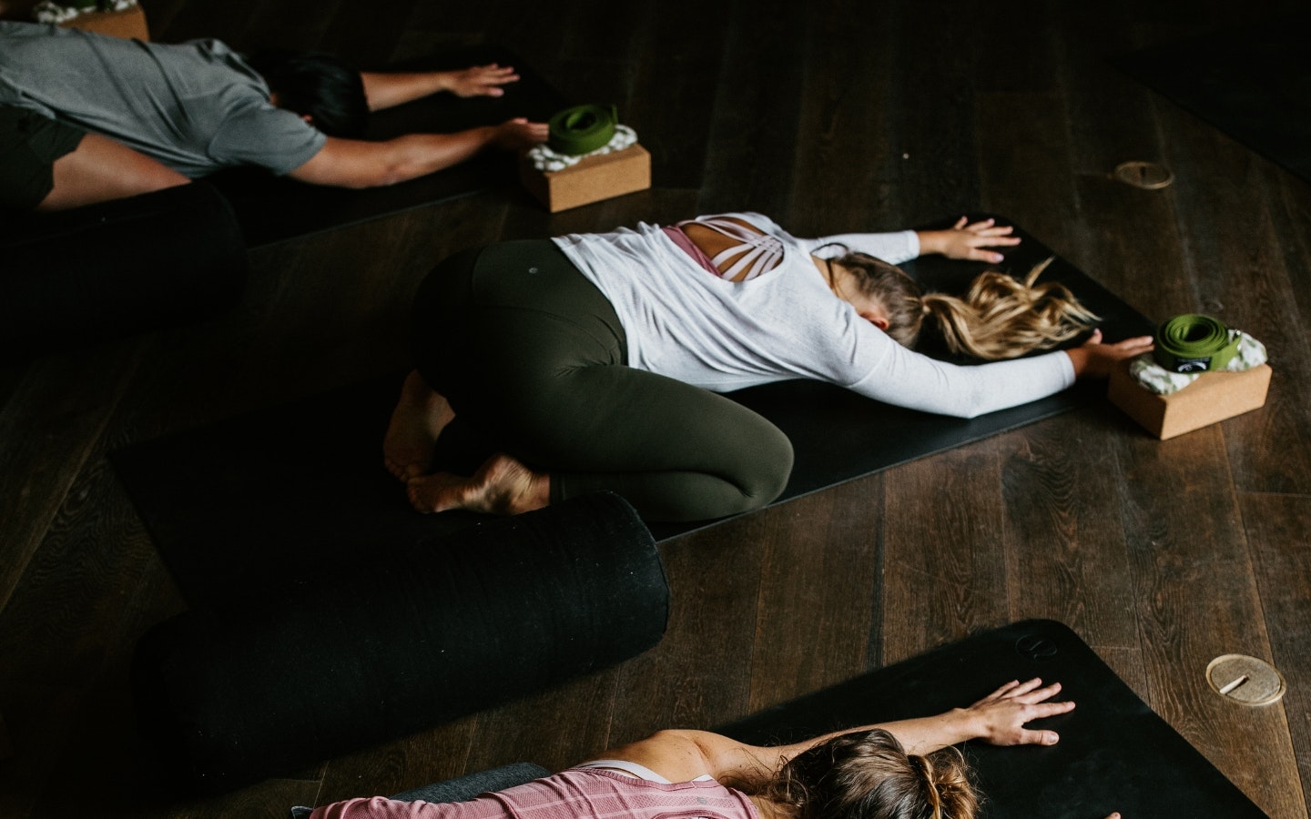 A group of people taking a yoga class