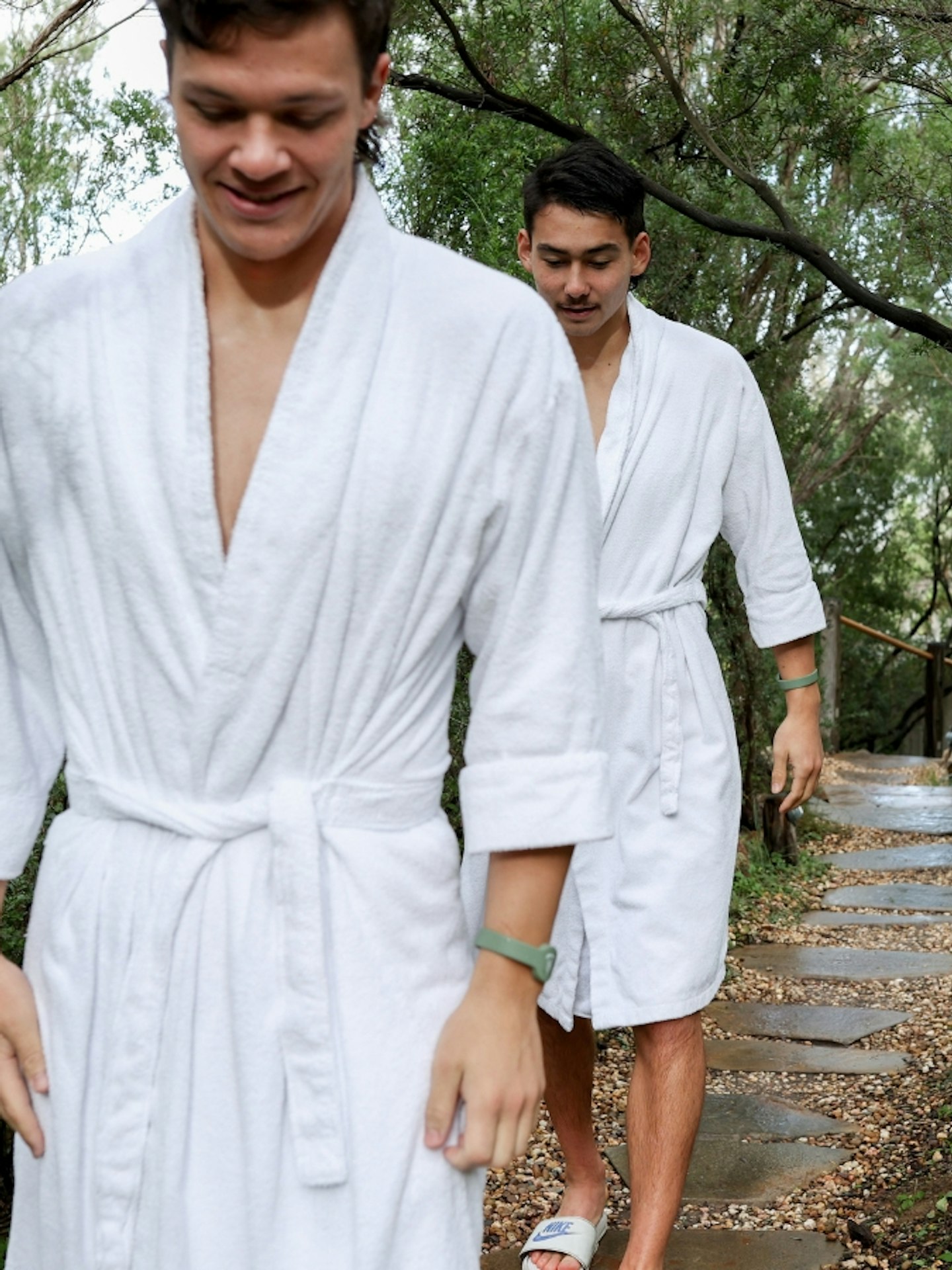 Two young boys in robes walking through the Spa Dreaming Centre