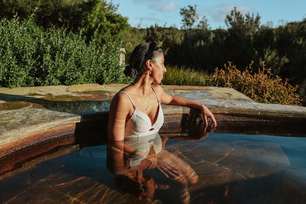 A woman bathing in geothermal springs
