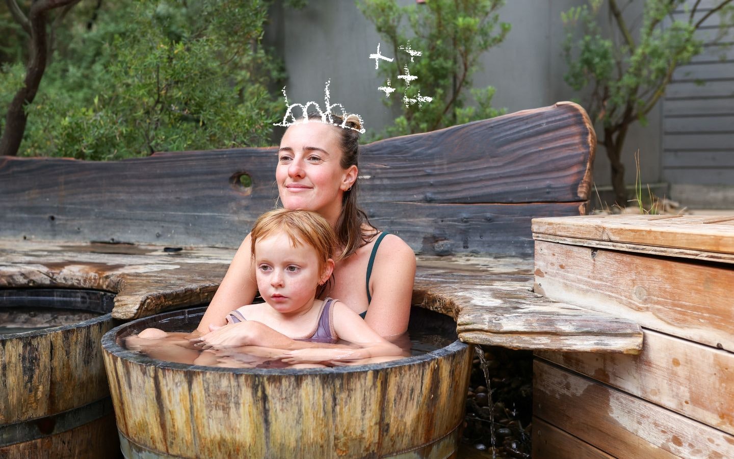 Mother and daughter in a barrel pool