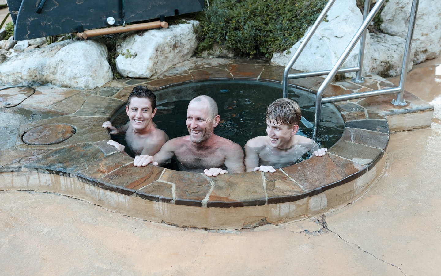 A father & two sons doing Fire & Ice at Peninsula Hot Springs