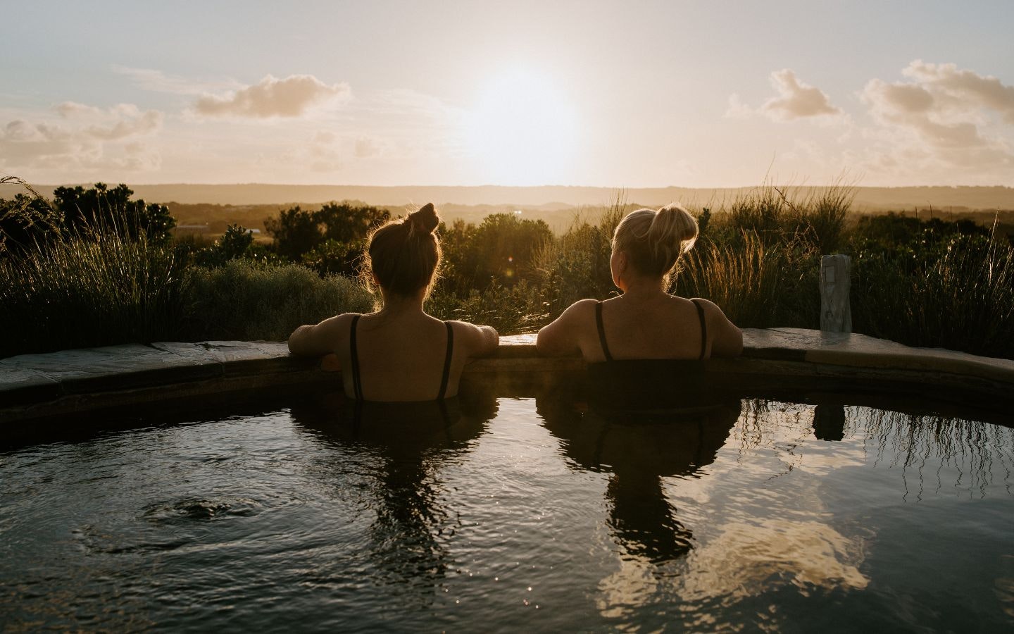 Communal bathing looking at sunset