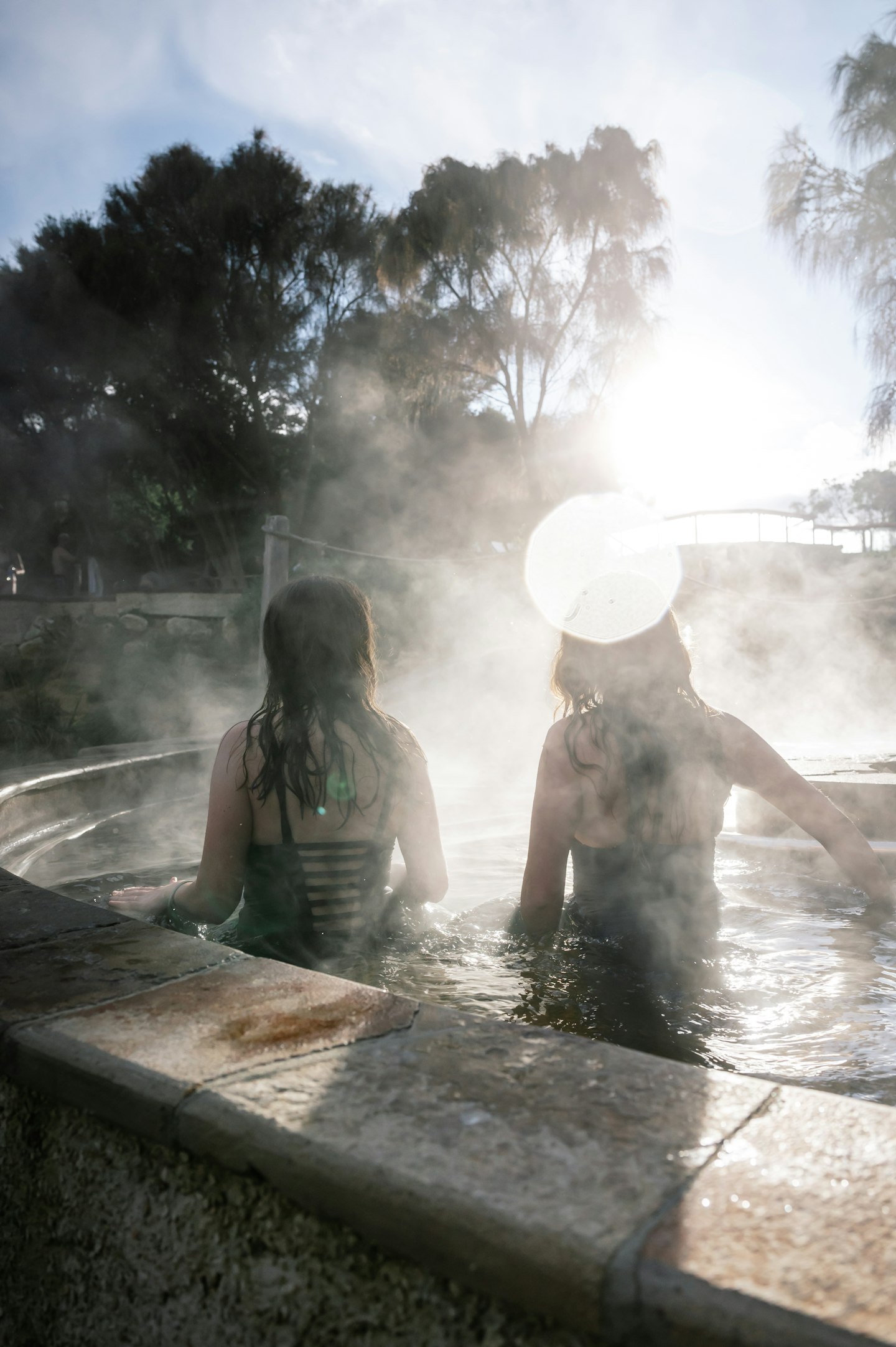Two friends bathing in hot springs