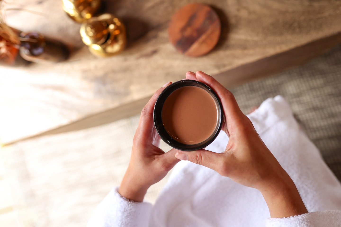 Hands holding a cup of cacao