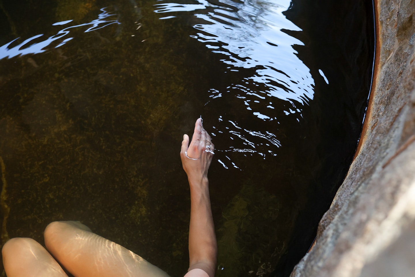 A hand moving through water