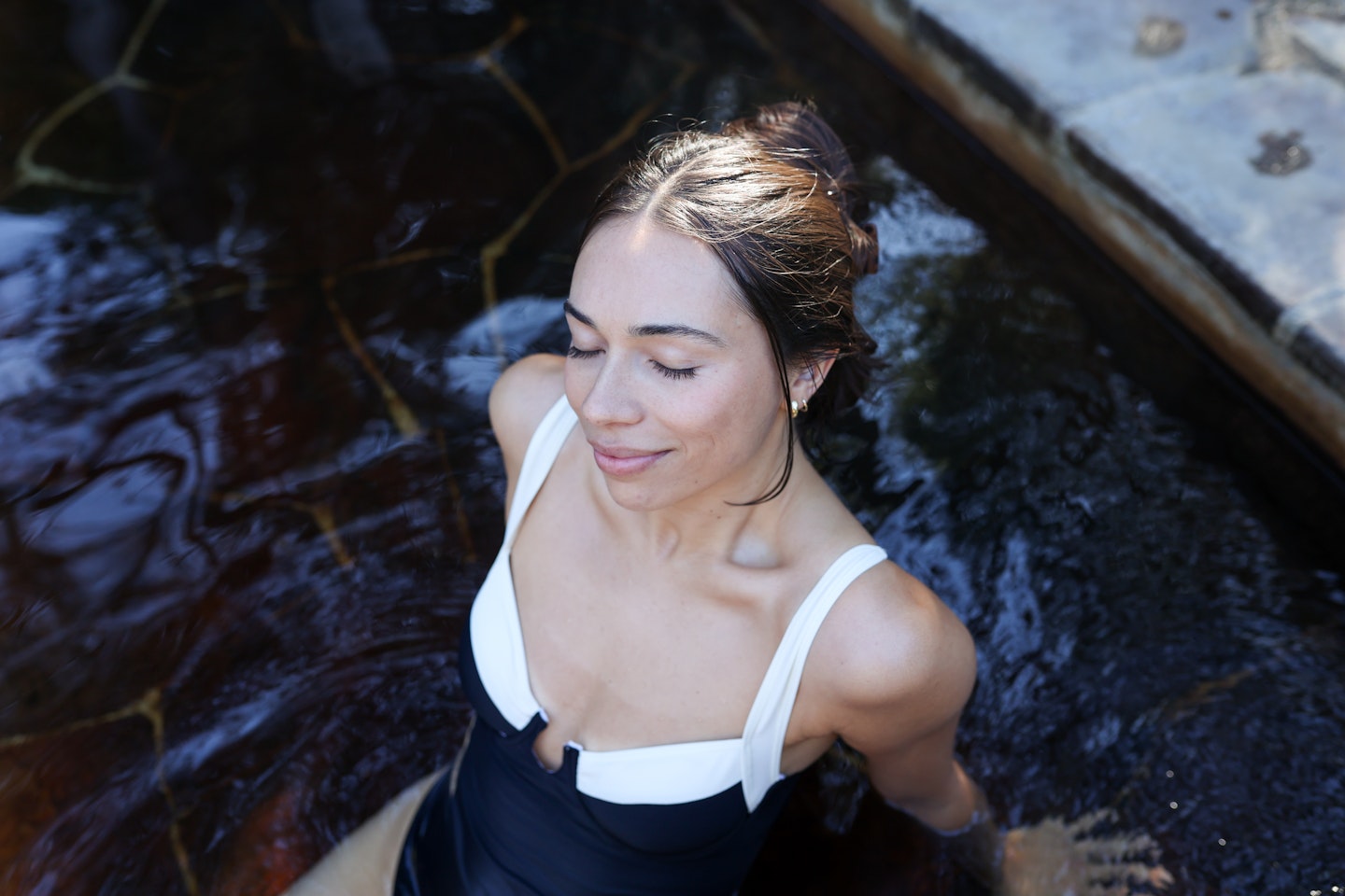 A woman bathing in hot springs