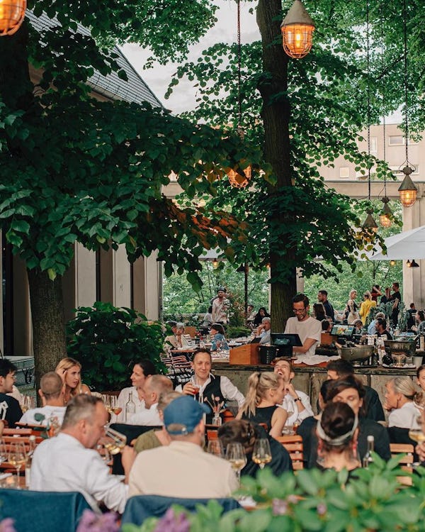 Summer outdoor evening seating at Kink Bar in Berlin