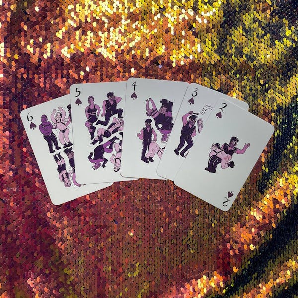 Polar Embassy Club of Queens cards by Rory Midhani shown over sequins