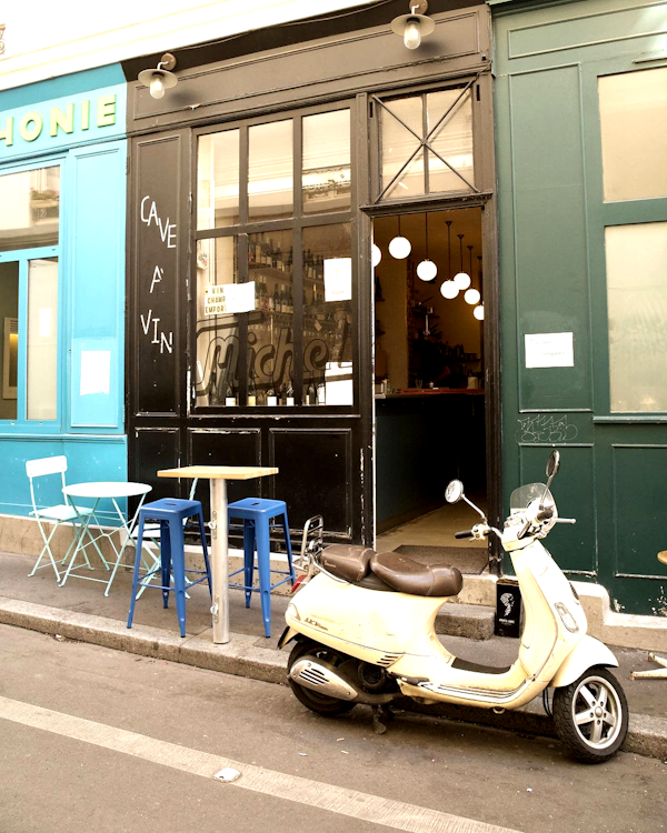 a scooter parked outside a restaurant