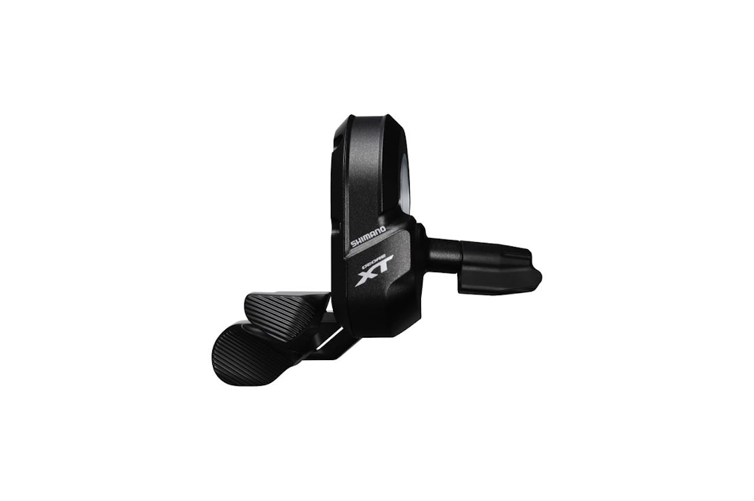 OVERFLØDIG: Den venstre girspaken trenger du ikke lenger, men du kan med Shimanos E-tubes program sette den opp til å gjøre andre ting enn å skifte gir. Låse gaffelen for eksempel. OVERFLØDIG: Den venstre girspaken trenger du ikke lenger, men du kan med Shimanos E-tubes program sette den opp til å gjøre andre ting enn å skifte gir. Låse gaffelen for eksempel.