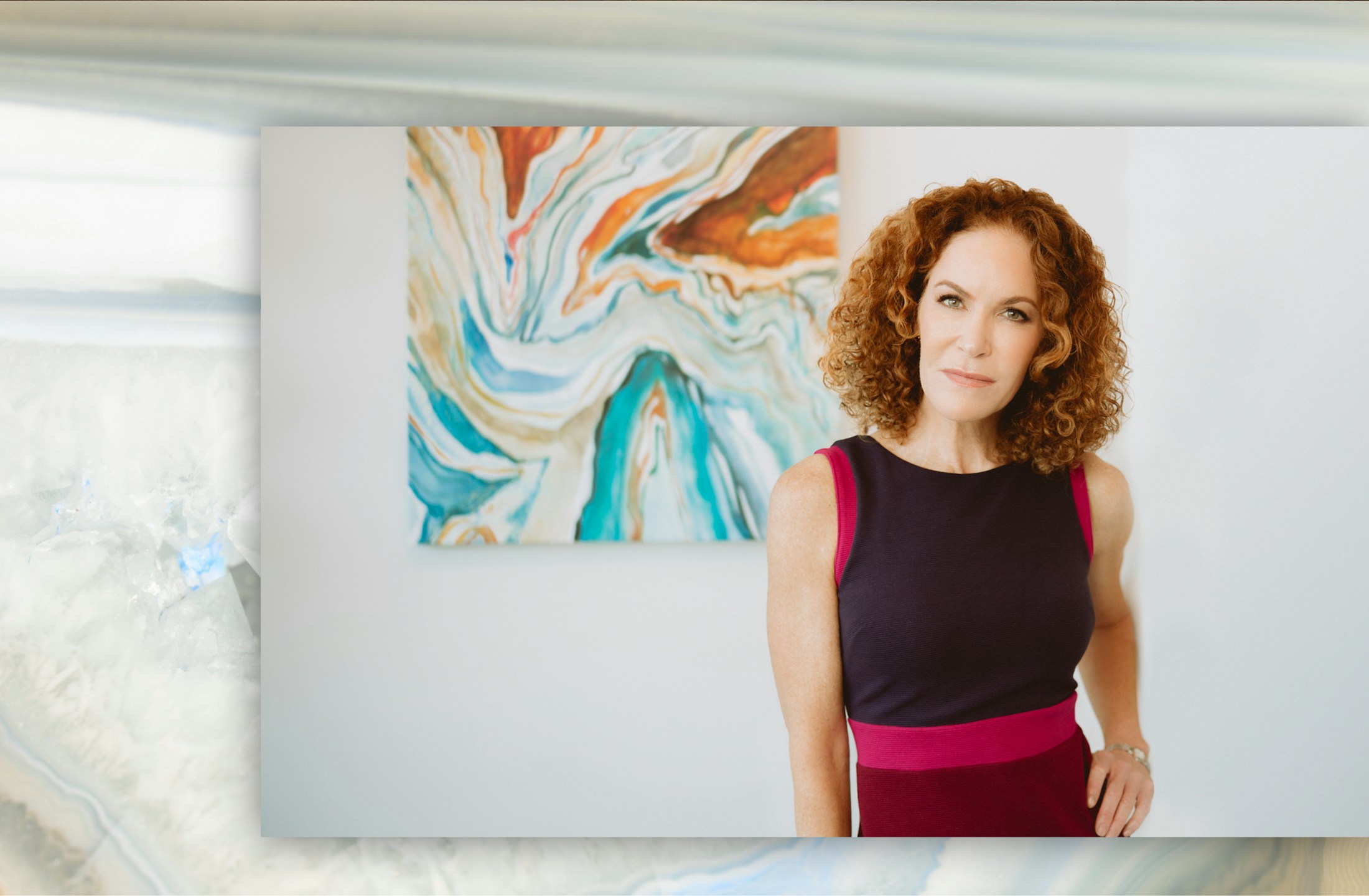 Dr. Mary Lynn Moran Standing in front of painting