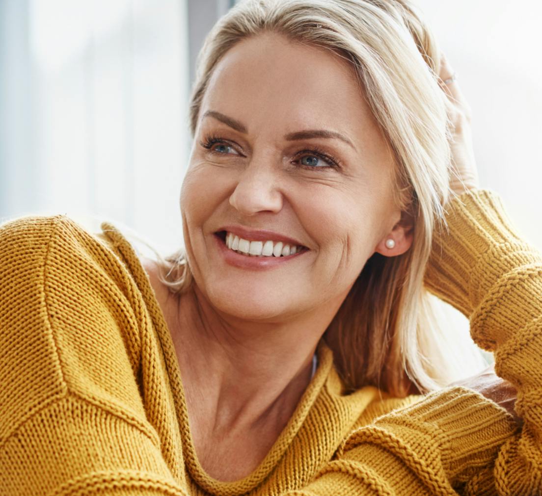 Smiling Attractive Woman with Yellow sweater