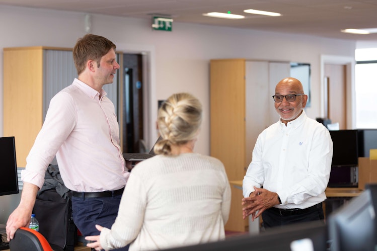 Harish Sodha chatting to two Account Managers at Diversity Travel