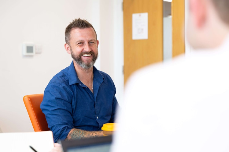 Smiling man in meeting