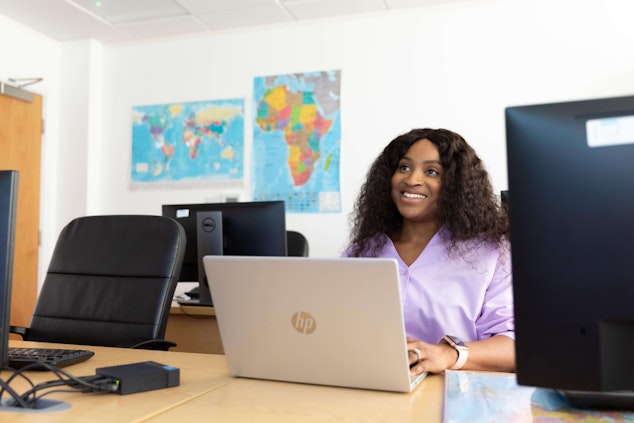 Girl at desk with laptop