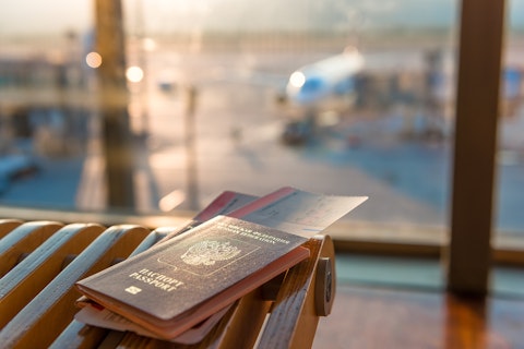 Image of passport resting on table in airport