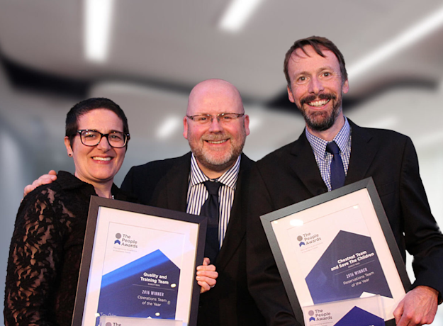 Diversity Travel team holding certificates