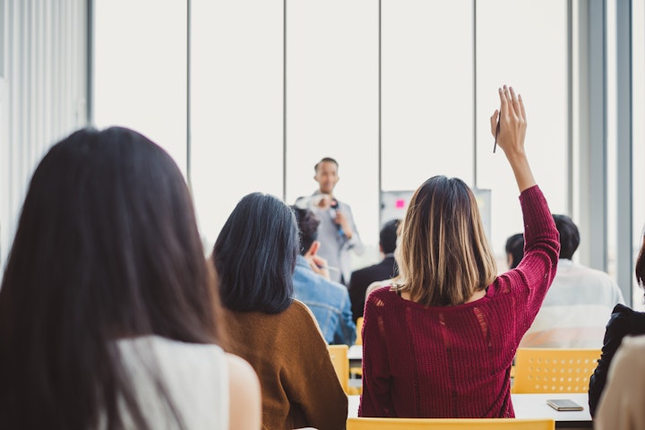 Student with hand raised