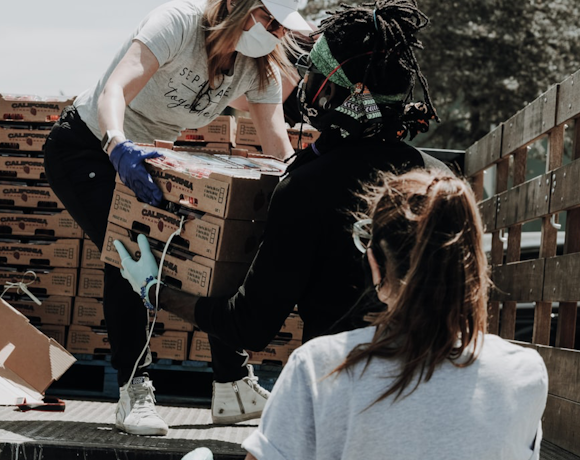 Volunteer delivering food and charity supplies