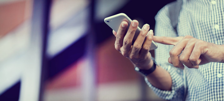 Traveller using his mobile phone