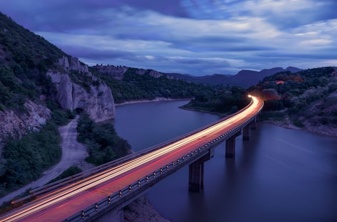 Bridge with lights stretching into distance