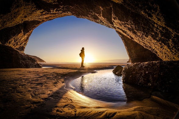 Lone traveller at sunset