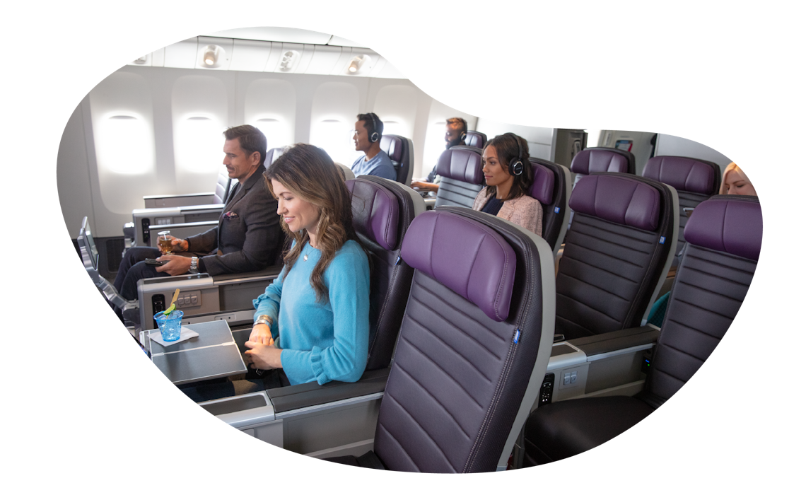 Passengers sitting down onboard a UA flight