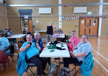 Braidwater Seniors Group Knitting Bunting for NI Centenary