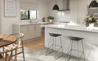 L shaped kitchen with island bench and bar stools