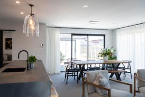 Open plan living, concrete kitchen benchtop