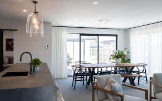 Open plan living, concrete kitchen benchtop