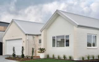 NZ house with white cladding and brick cladding