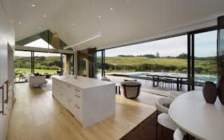 Island kitchen design with stone bench top waterfall kitchen design