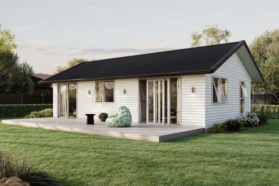 Signature Homes Minor Dwelling home with white weatherboard cladding, dark grey steel roof and light timber decking