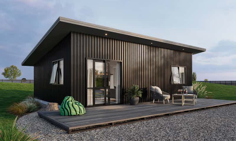 Small minor dwelling home with dark vertical cladding ideal for a beach house and air bnb rental