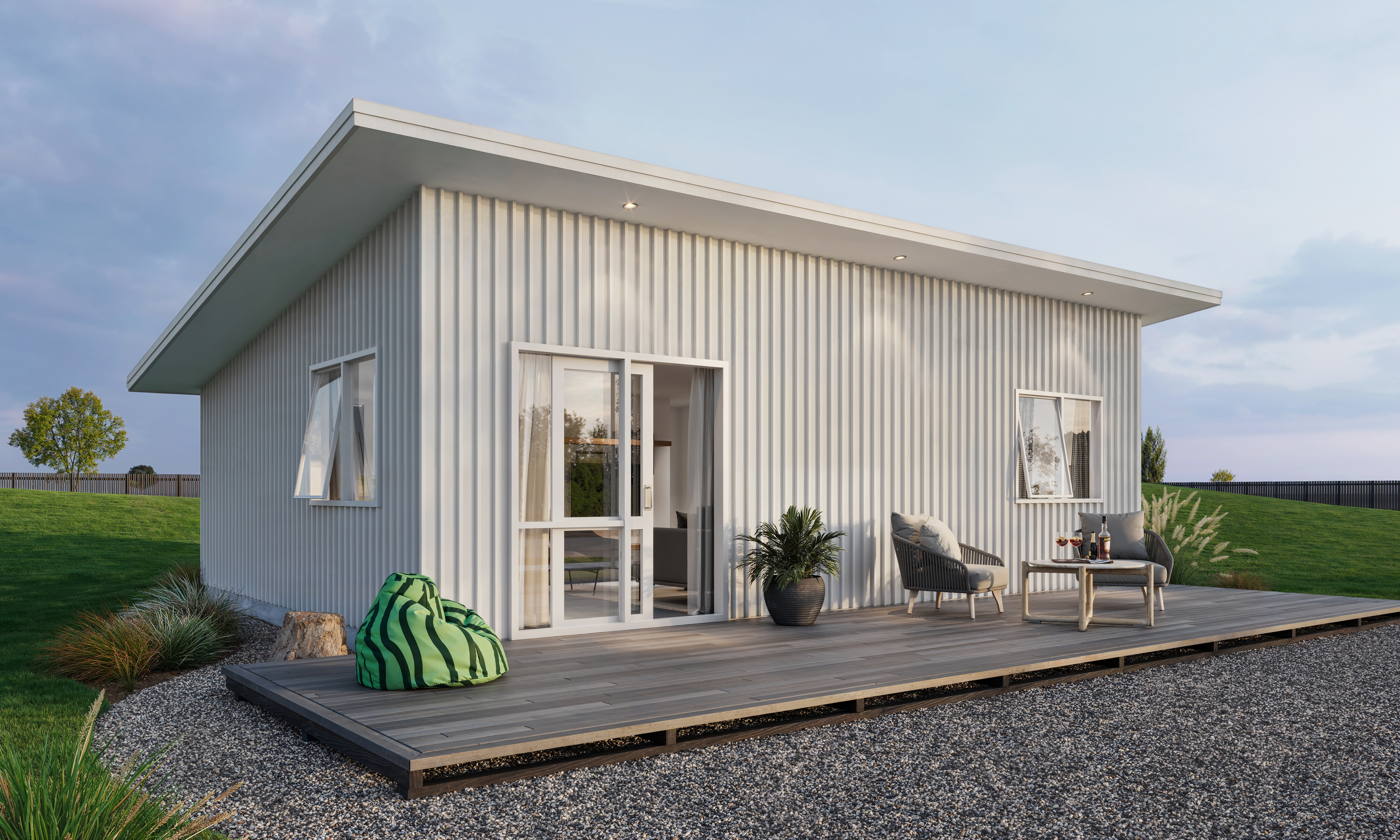 two bedroom minor dwelling with white vertical steel cladding and decking