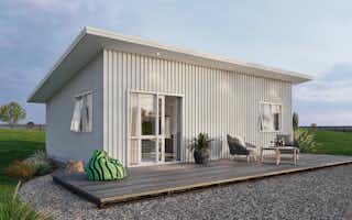 two bedroom minor dwelling with white vertical steel cladding and decking