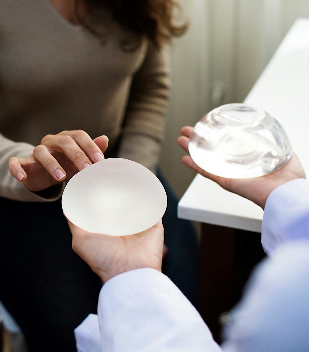 woman being shown two different implants