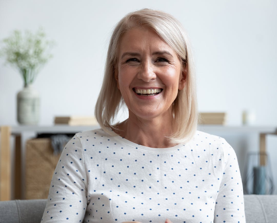 woman in white shirt smiling