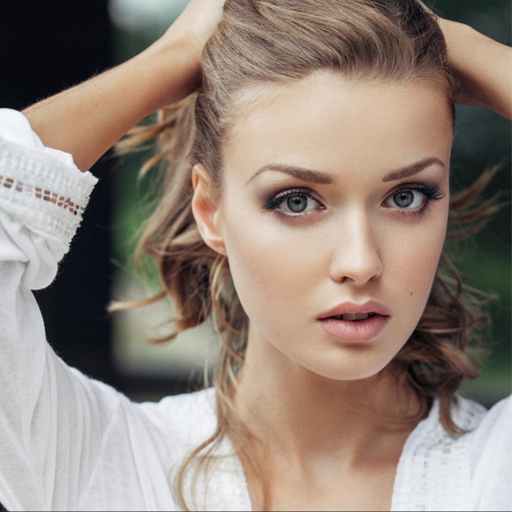 beautiful woman with her hands in her hair